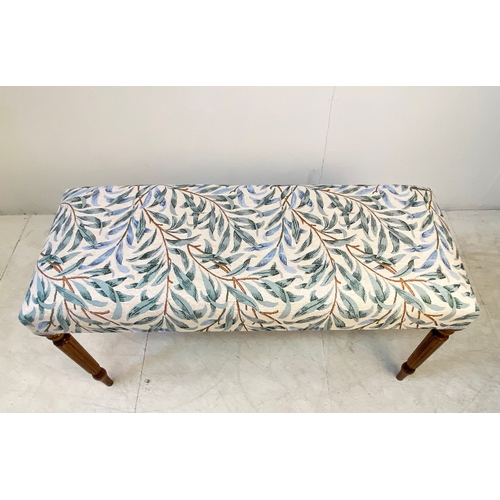 37 - LONG STOOL WITH BOTANICAL DESIGN UPHOLSTERY ON REEDED SUPPORTS. 47cm H x 100cm W x 40cm D.