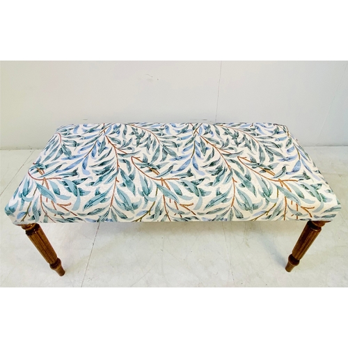 37 - LONG STOOL WITH BOTANICAL DESIGN UPHOLSTERY ON REEDED SUPPORTS. 47cm H x 100cm W x 40cm D.