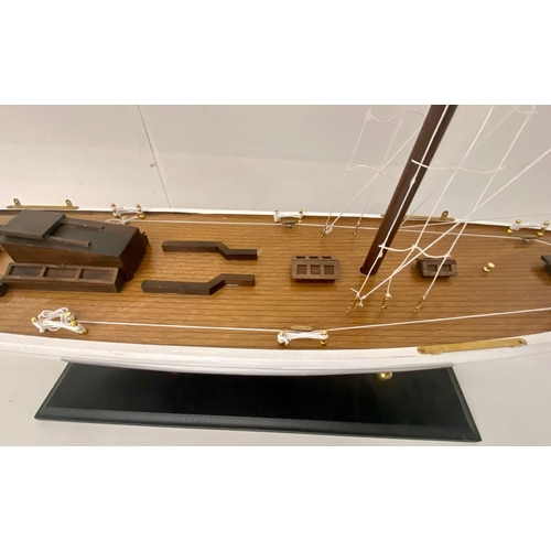 38 - MODEL SAILING BOAT ON STAND. 150cm H x 135cm W x 21cm D.
