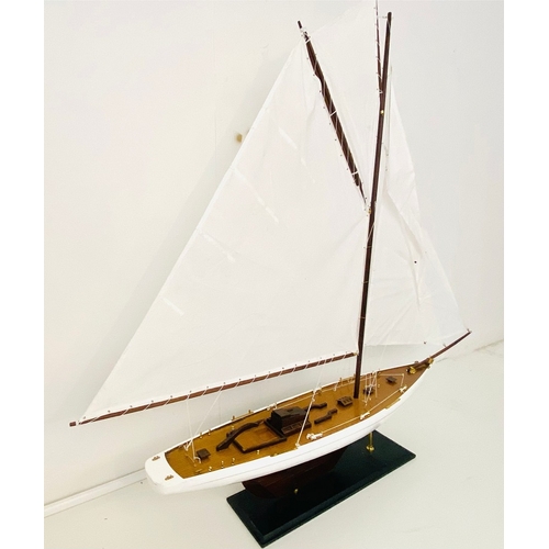 38 - MODEL SAILING BOAT ON STAND. 150cm H x 135cm W x 21cm D.