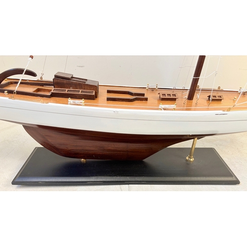 38 - MODEL SAILING BOAT ON STAND. 150cm H x 135cm W x 21cm D.