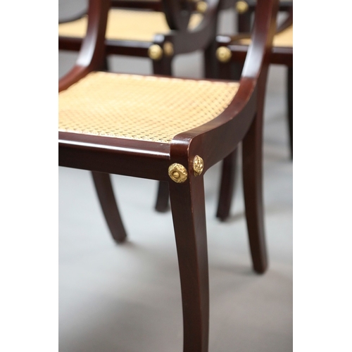 47 - SET OF TWELVE REGENCY STYLE DINING CHAIRS (12). mahogany finish and gilt highlights including two ar... 