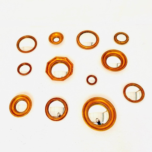 57 - SET OF TWELVE CONVEX MIRRORS WITH GILT FRAMES. various sizes and designs,  26cm diam. at largest app... 