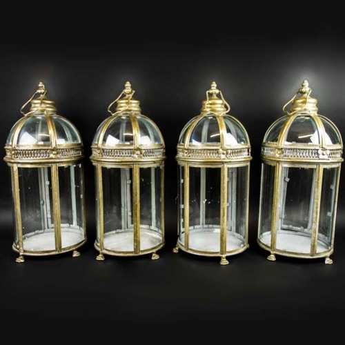 61 - SET OF FOUR REGENCY STYLE GILT METAL AND GLASS LANTERNS. 46cm H x 19cm W.