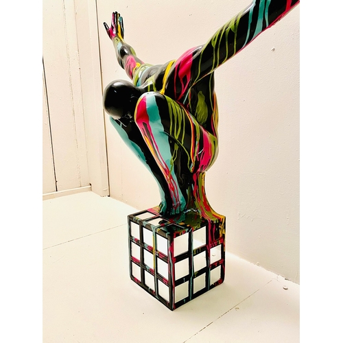 72 - CONTEMPORARY DIVER SCULPTURE IN PAINT SPLATTERED FINISH. 81cm H x 82cm W x 28cm D.