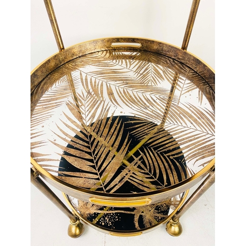 75 - GILT METAL DRINKS TROLLEY WITH PALM TREE DESIGN SHELVES. 87cm H x 45cm W x 47cm D.