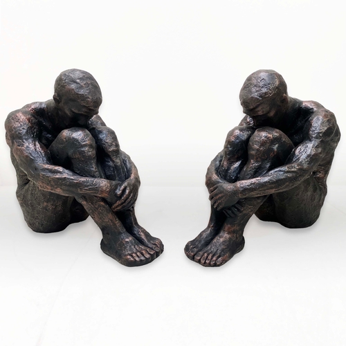 76 - PAIR OF SITTING MAN SCULPTURES IN BRONZED FINISH RESIN. 34cm H x 21cm W x 49cm D.