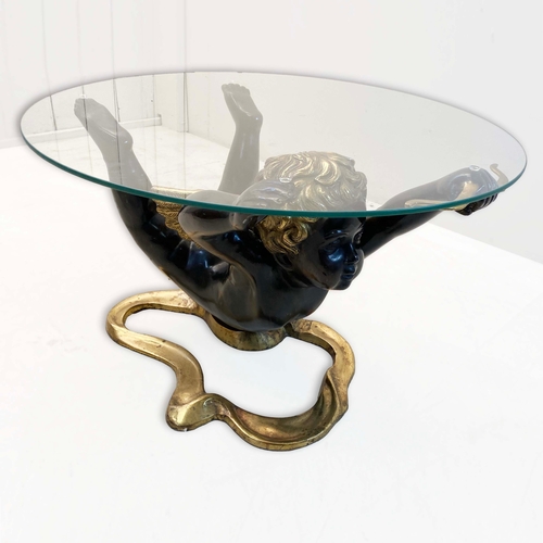 77 - CHERUB COFFEE TABLE WITH GLASS TOP ON PAINTED METAL BASE. 40cm H x 60cm W.