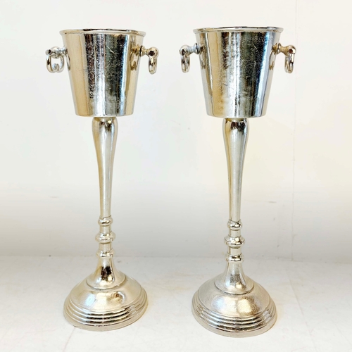 78 - PAIR OF POLISHED METAL WINE COOLERS ON STANDS. 77cm H x 30cm W x 24cm D.