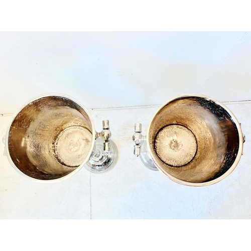 78 - PAIR OF POLISHED METAL WINE COOLERS ON STANDS. 77cm H x 30cm W x 24cm D.