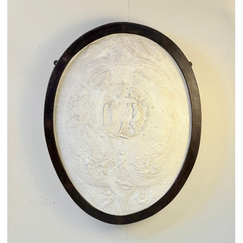 8 - CLASSICAL STYLE PLASTER WALL PLAQUE. in a black frame, 100cm H x 73cm W.