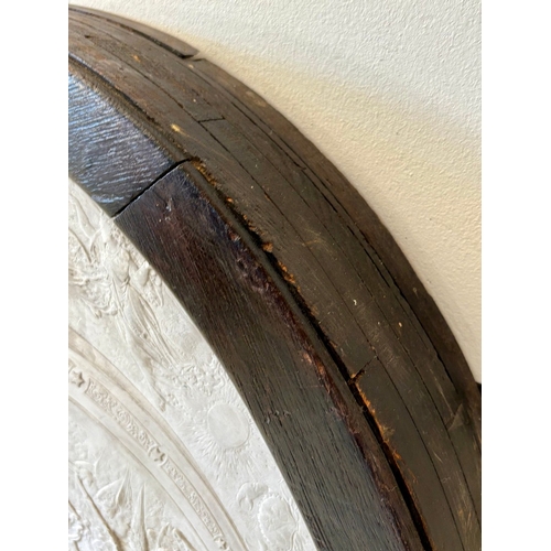 8 - CLASSICAL STYLE PLASTER WALL PLAQUE. in a black frame, 100cm H x 73cm W.