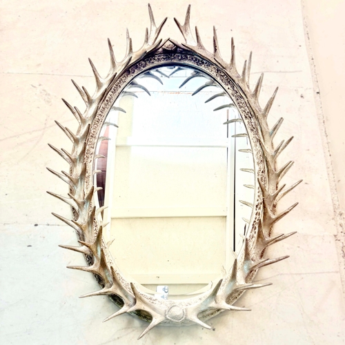 81 - WALL MIRROR WITH A SILVERED FAUX ANTLER FRAME. 85cm H x 45cm W.