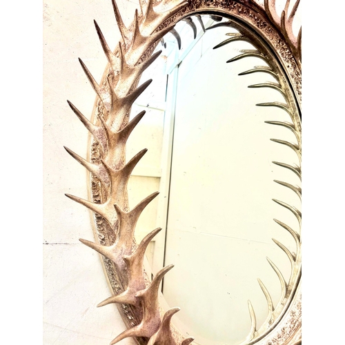 81 - WALL MIRROR WITH A SILVERED FAUX ANTLER FRAME. 85cm H x 45cm W.