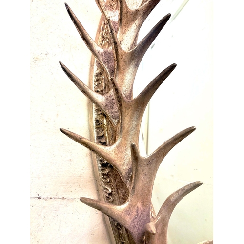 81 - WALL MIRROR WITH A SILVERED FAUX ANTLER FRAME. 85cm H x 45cm W.