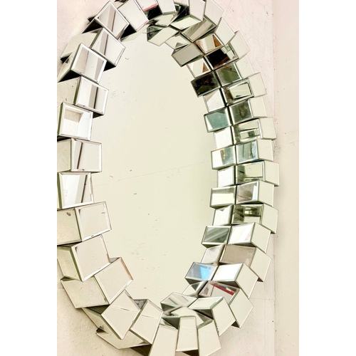 83 - CONTEMPORARY OVAL WALL MIRROR WITH SEGMENTED MIRRORED FRAME. 80cm H x 40cm W.