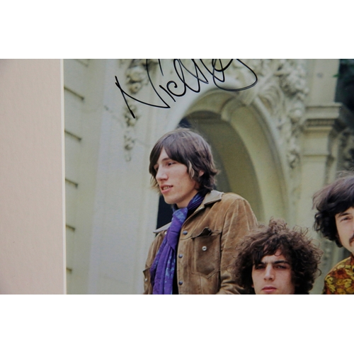 157 - PINK FLOYD, 1967, SIGNED BY NICK MASON. A photograph from a car photoshoot with rock band Pink Floyd... 
