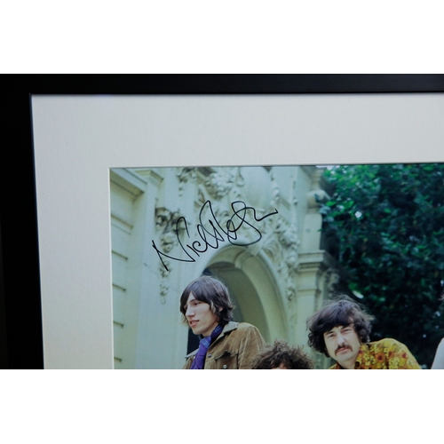 157 - PINK FLOYD, 1967, SIGNED BY NICK MASON. A photograph from a car photoshoot with rock band Pink Floyd... 