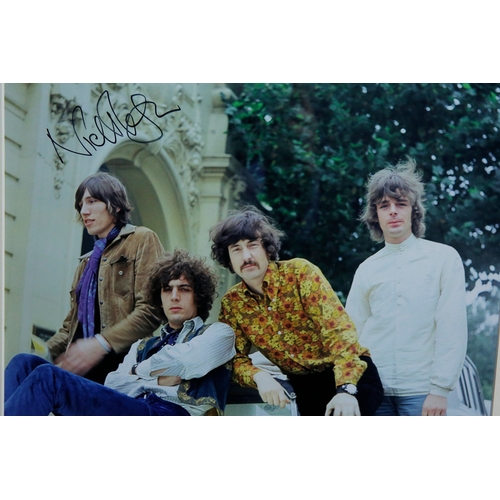 157 - PINK FLOYD, 1967, SIGNED BY NICK MASON. A photograph from a car photoshoot with rock band Pink Floyd... 