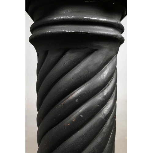 19 - A PAIR OF WOODEN MALE TORSO FIGURES. ebonised, measuring 70cm high, complete with black painted terr... 