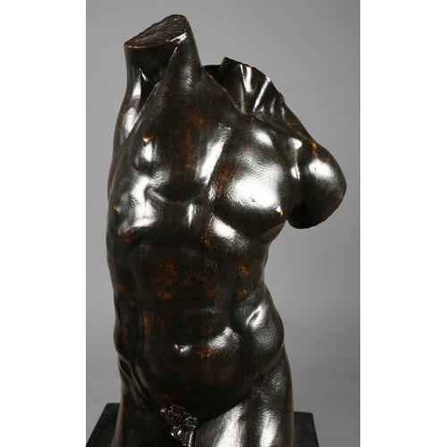 19 - A PAIR OF WOODEN MALE TORSO FIGURES. ebonised, measuring 70cm high, complete with black painted terr... 