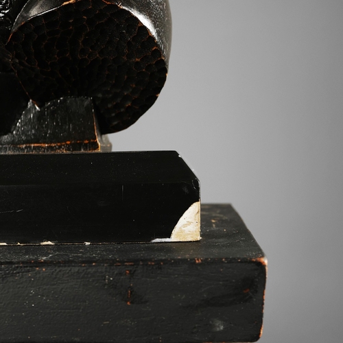 19 - A PAIR OF WOODEN MALE TORSO FIGURES. ebonised, measuring 70cm high, complete with black painted terr... 