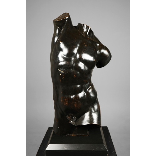 19 - A PAIR OF WOODEN MALE TORSO FIGURES. ebonised, measuring 70cm high, complete with black painted terr... 