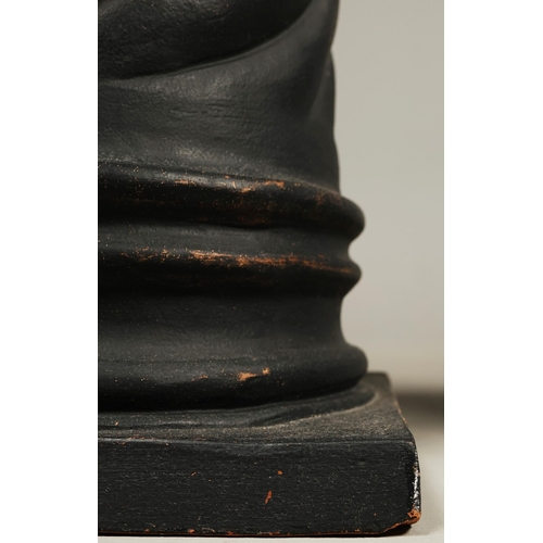 19 - A PAIR OF WOODEN MALE TORSO FIGURES. ebonised, measuring 70cm high, complete with black painted terr... 