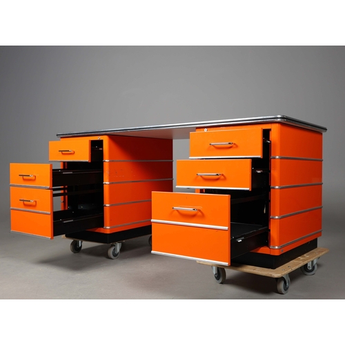 274 - MULLER CLASSIC LINE CHRYSLER DESK. orange lacquered steel, with six drawers, 77cm H x 176cm W x 80cm... 