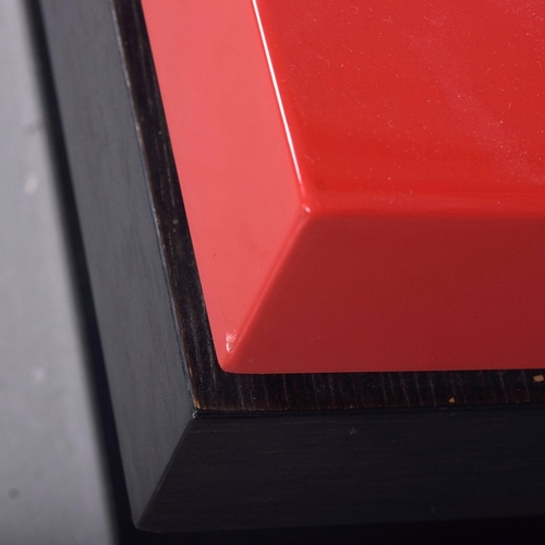 284 - LIGNE ROSET STRATES RED AND BLACK COFFEE TABLE. The top two tiers rotate
35cm H x 80cm W x 80cm D.