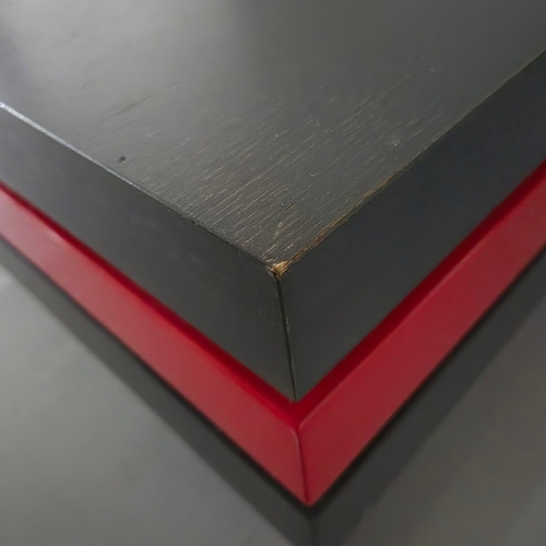 284 - LIGNE ROSET STRATES RED AND BLACK COFFEE TABLE. The top two tiers rotate
35cm H x 80cm W x 80cm D.