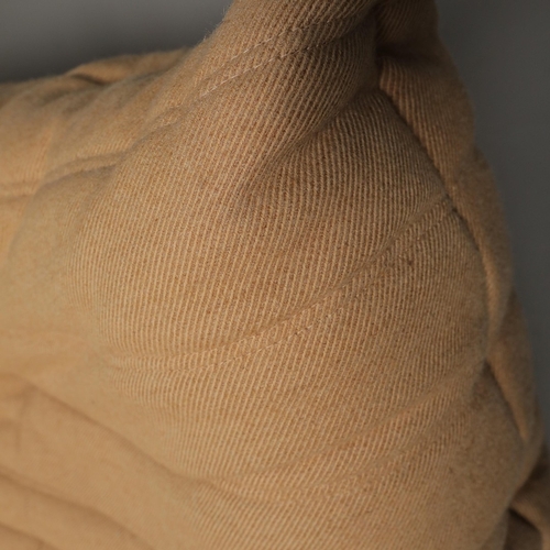 285 - LIGNE ROSET TOGO SOFA AND CHAIR (2). 130cm w in a tan fabric and a matching chair 80cm w, marks to f... 