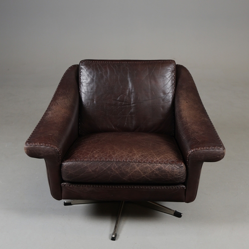 327 - ERHARDSEN & ANDERSEN MATADOR SWIVEL ARMCHAIR. by Aage Christiansen, 90cm W x 80cm D.