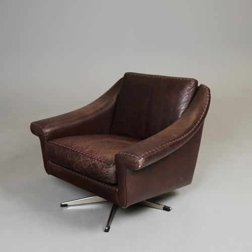 327 - ERHARDSEN & ANDERSEN MATADOR SWIVEL ARMCHAIR. by Aage Christiansen, 90cm W x 80cm D.