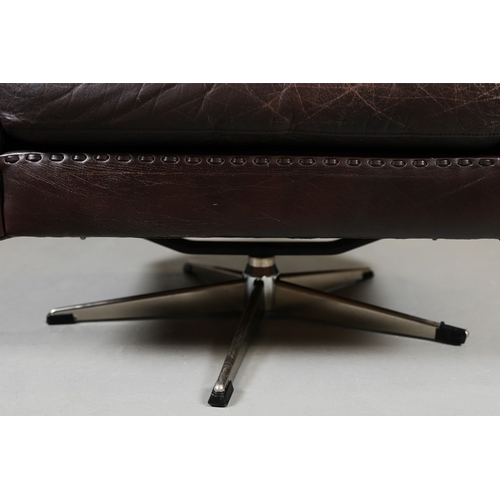 327 - ERHARDSEN & ANDERSEN MATADOR SWIVEL ARMCHAIR. by Aage Christiansen, 90cm W x 80cm D.