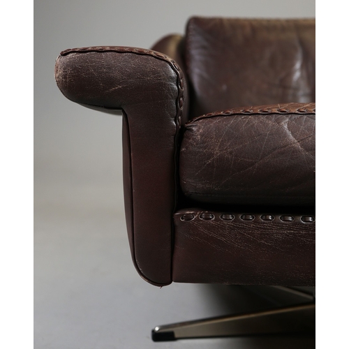 327 - ERHARDSEN & ANDERSEN MATADOR SWIVEL ARMCHAIR. by Aage Christiansen, 90cm W x 80cm D.