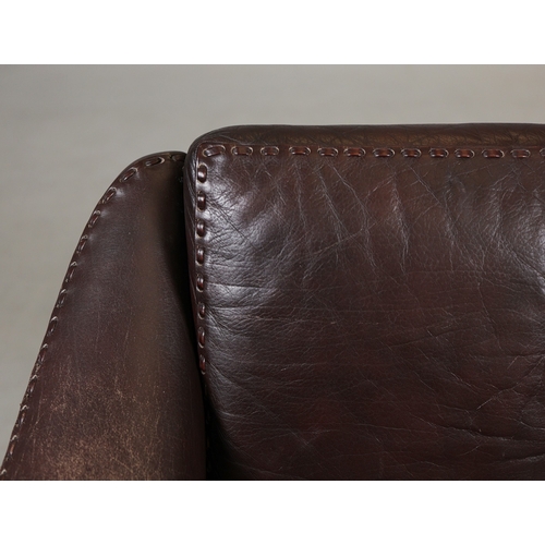 327 - ERHARDSEN & ANDERSEN MATADOR SWIVEL ARMCHAIR. by Aage Christiansen, 90cm W x 80cm D.