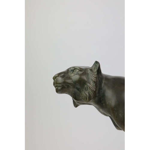 5 - A FRENCH ART DECO LION AND LIONESS SCULPTURE. in spelter on stepped black and white marble base. 85c... 