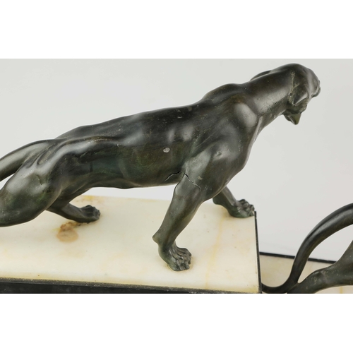 5 - A FRENCH ART DECO LION AND LIONESS SCULPTURE. in spelter on stepped black and white marble base. 85c... 