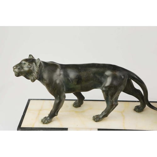 5 - A FRENCH ART DECO LION AND LIONESS SCULPTURE. in spelter on stepped black and white marble base. 85c... 