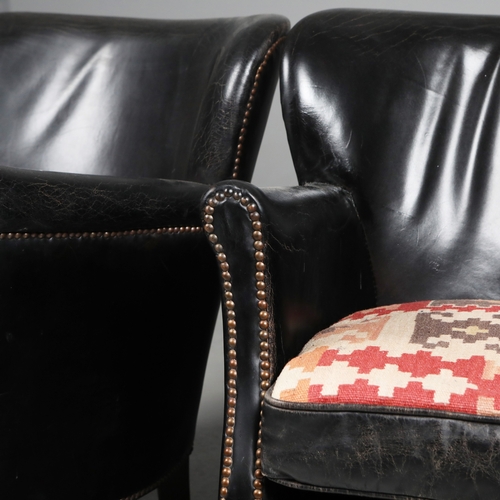 576 - ATTRIBUTED TO ANDREW MARTIN ARMCHAIRS, A PAIR. black leather with reversible kilim seat cushions, 74... 