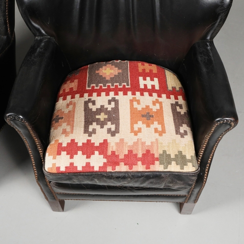 576 - ATTRIBUTED TO ANDREW MARTIN ARMCHAIRS, A PAIR. black leather with reversible kilim seat cushions, 74... 