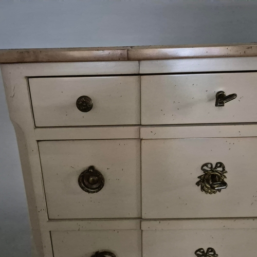 579 - ROCHE BOBOIS SEVEN DRAWER CHEST. in an antiqued painted finish 142 cm t x 70 cm w x 40 cm d.