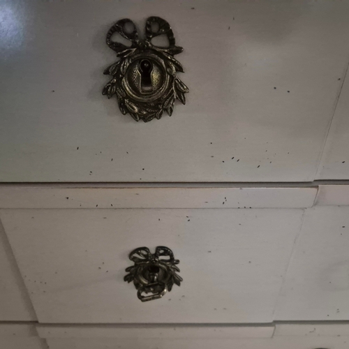 579 - ROCHE BOBOIS SEVEN DRAWER CHEST. in an antiqued painted finish 142 cm t x 70 cm w x 40 cm d.