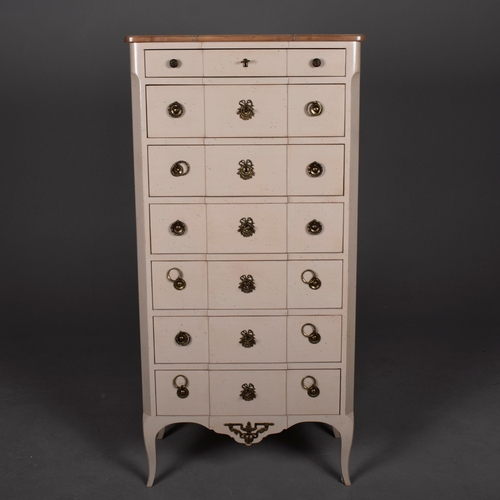 579 - ROCHE BOBOIS SEVEN DRAWER CHEST. in an antiqued painted finish 142 cm t x 70 cm w x 40 cm d.