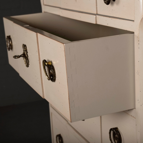 579 - ROCHE BOBOIS SEVEN DRAWER CHEST. in an antiqued painted finish 142 cm t x 70 cm w x 40 cm d.