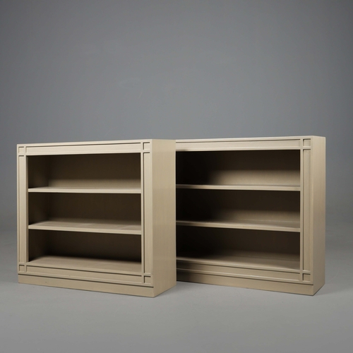 598 - OKA ANASTASIUS BOOKSHELVES, A PAIR. Grey painted finish 84cm H x 91cm W x 28cm D.
