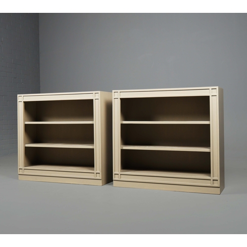 598 - OKA ANASTASIUS BOOKSHELVES, A PAIR. Grey painted finish 84cm H x 91cm W x 28cm D.