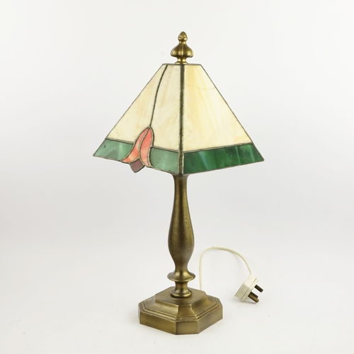 131 - TIFFANY STYLE TABLE LAMP. fitted with a four sided shade in cream and green, raised on a brass lamp ... 