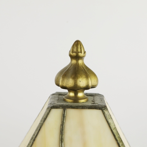 131 - TIFFANY STYLE TABLE LAMP. fitted with a four sided shade in cream and green, raised on a brass lamp ... 